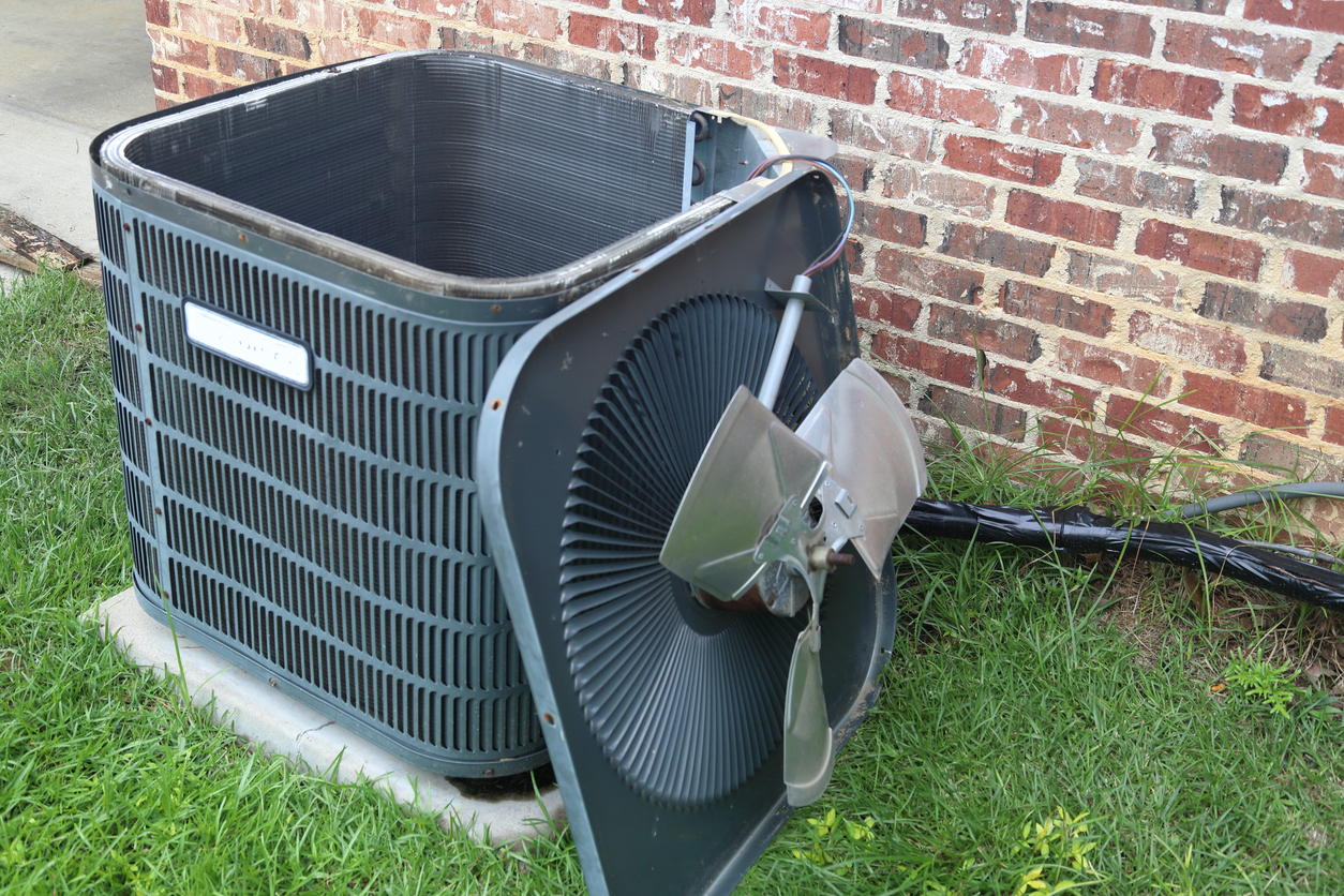 HVAC condenser unit with fan removed for maintenance